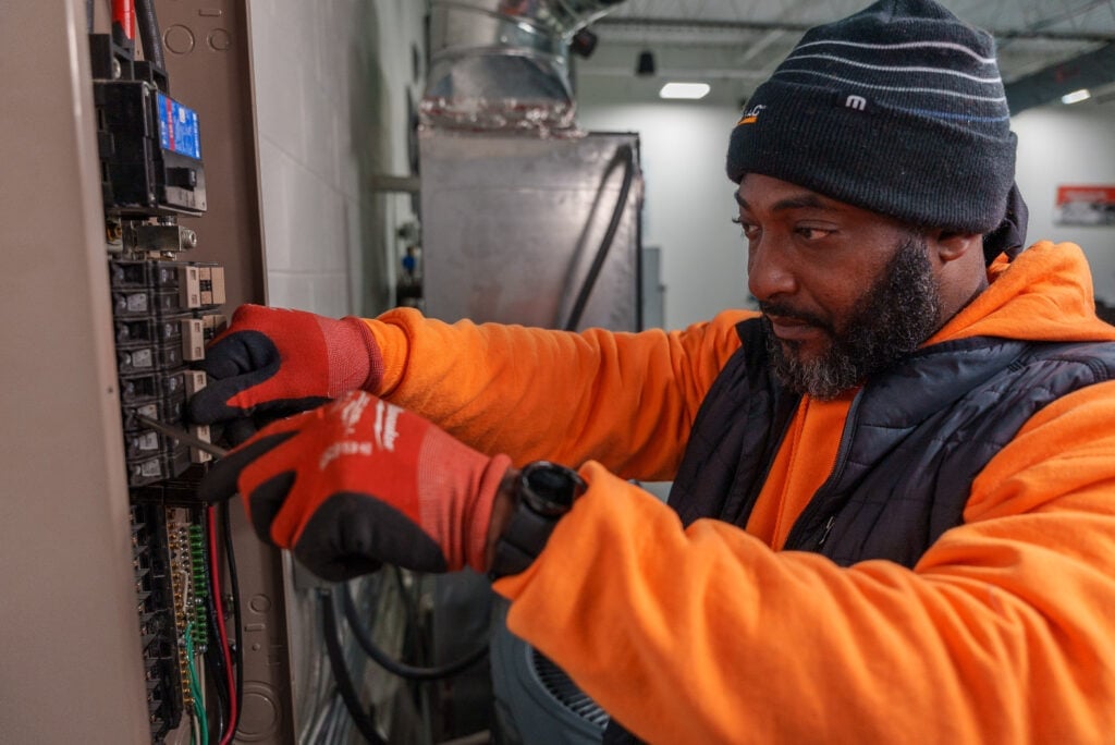 A technician performing diagnostic work