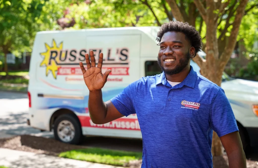 Russell's technician waving